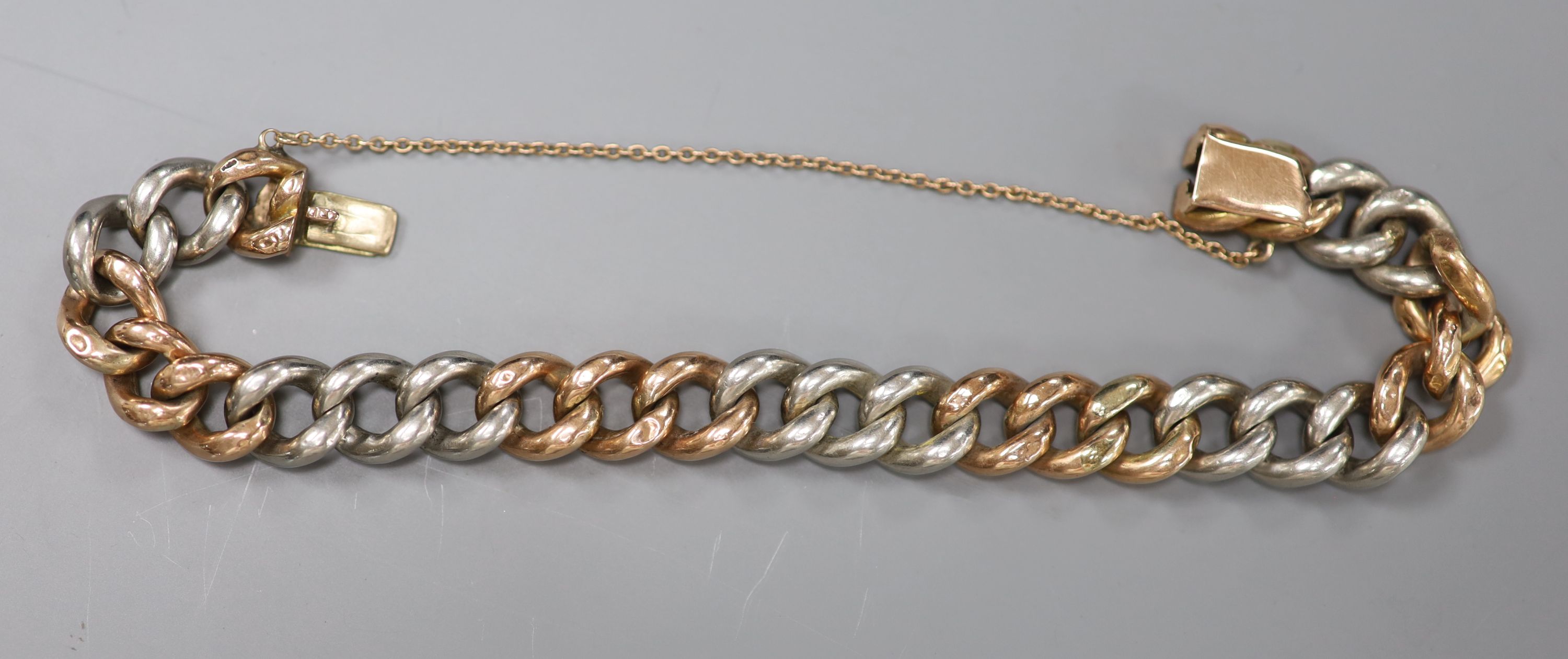 A yellow and white metal curblink bracelet (a.f.),